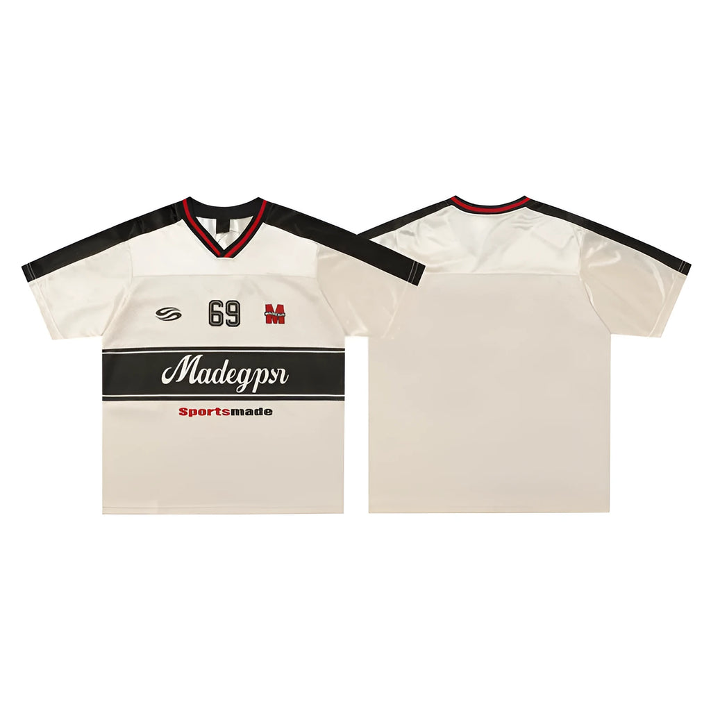 Apricot coloured loose fit V-neck sports jersey with short sleeves and a printed letter pattern.