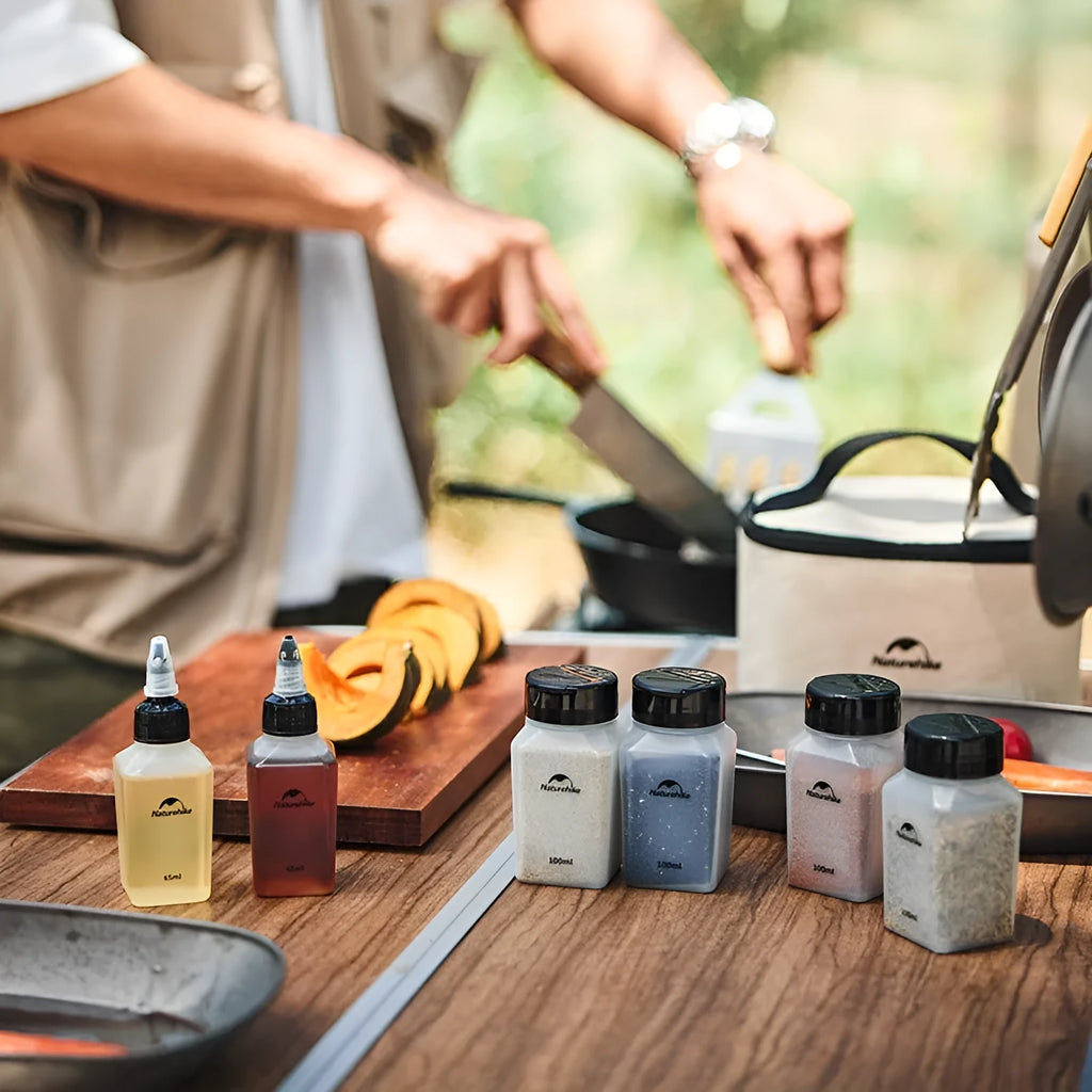 Naturehike six clear plastic portable seasoning bottles with black lids, modern simple design.