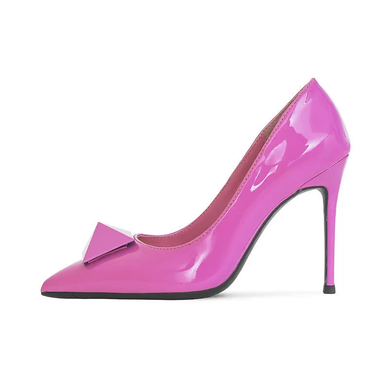 Pink patent leather women's stiletto heels with an ankle buckle and pointed toe.