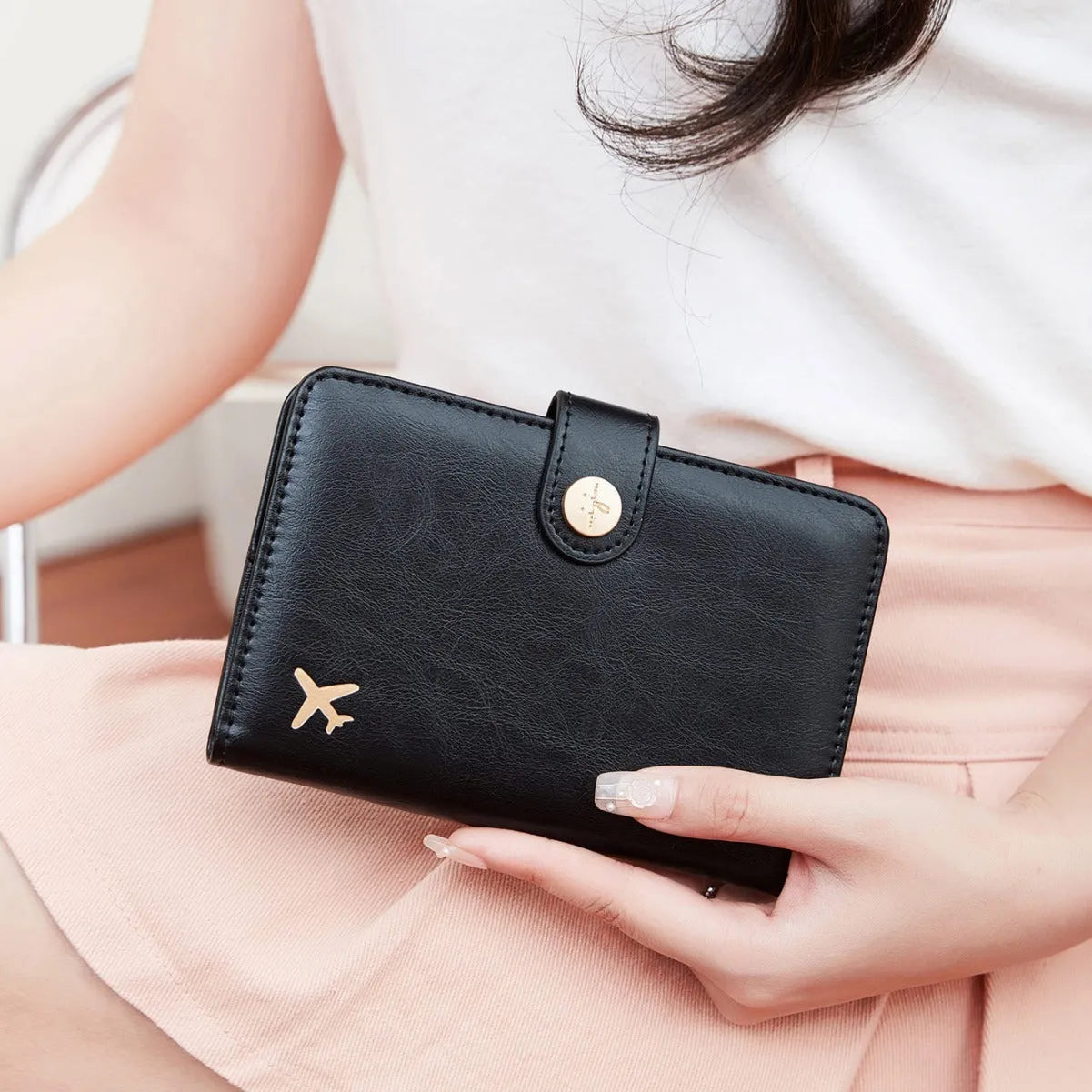 PU passport holder wallet in multiple colours with zip closure and visible sewing detail.