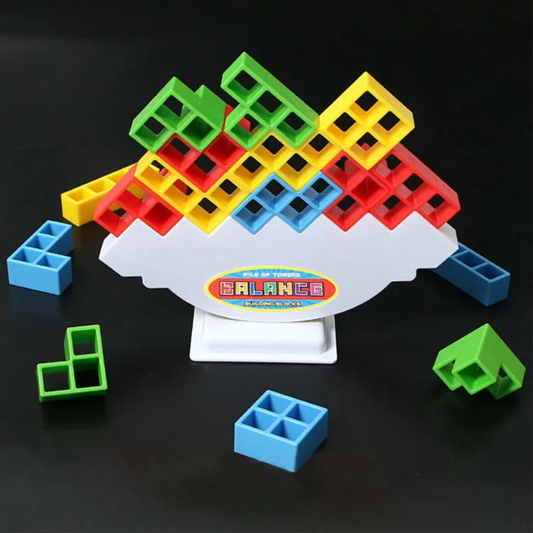 Plastic balance stacking game with colourful building blocks on chassis for family play