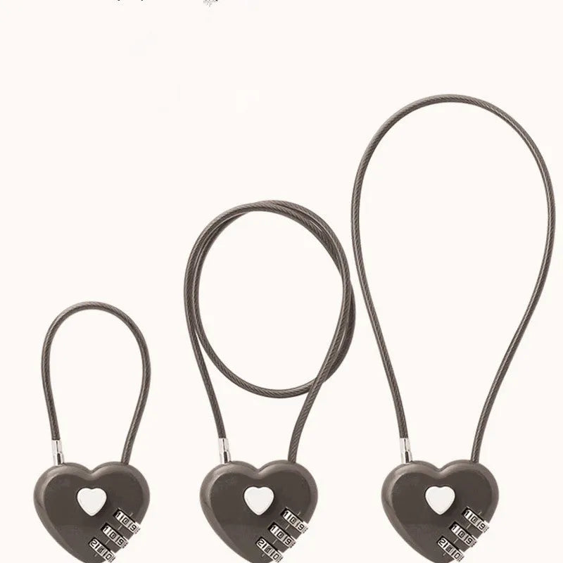 Heart-shaped ABS plastic cable lock with steel rope in multiple colour options for securing bicycle helmets.