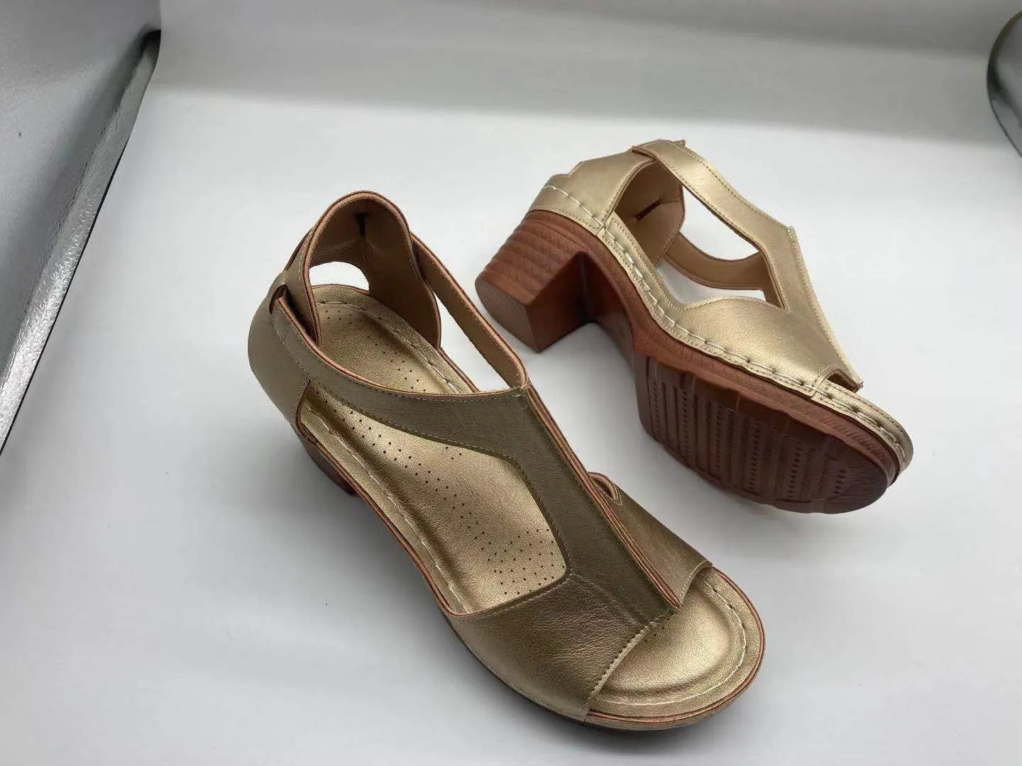 Women's peep toe wedge sandal with buckle on low heel, open fish mouth toe, in light brown
