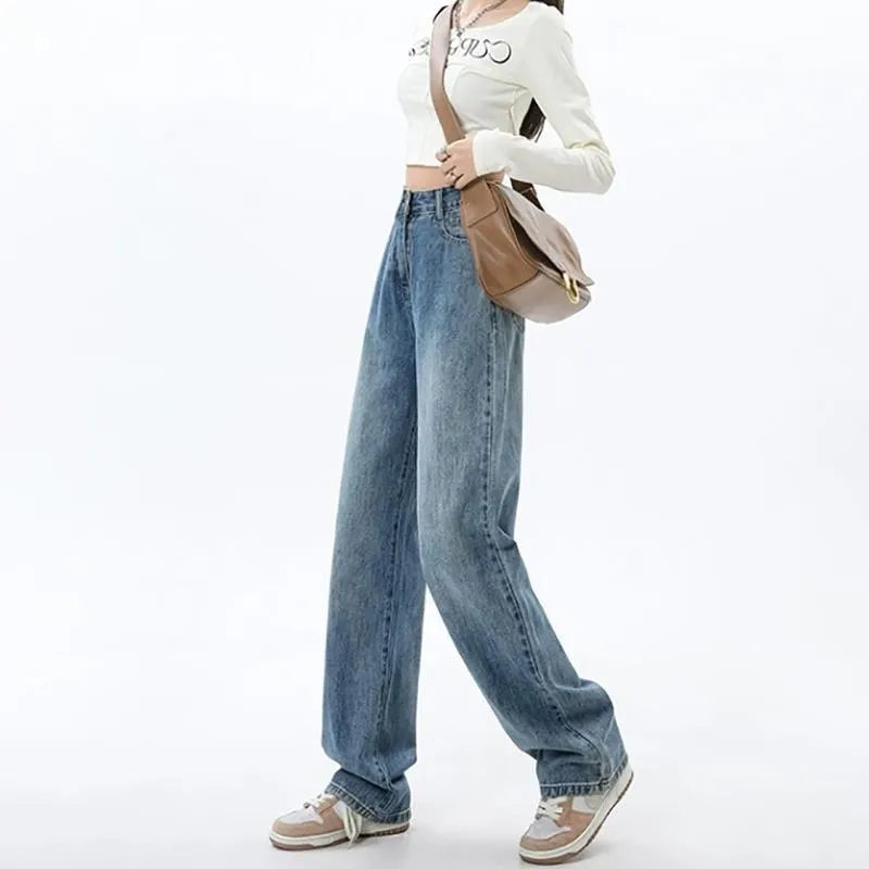 Woman wearing retro blue high-waisted wide-leg denim jeans with a straight-leg cut.