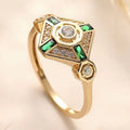 Square cut emerald diamond women's fashion ring with a lvzuan green stone on a silver electroplated band.