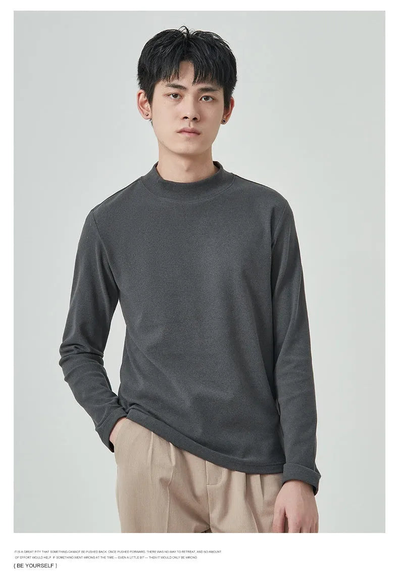 Man wearing a brown Dralon half-high collar long sleeve t-shirt for casual autumn wear.