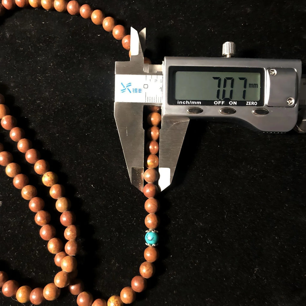 108-bead stone bracelet with geometric hand-polished beads measuring 5-6mm diameter