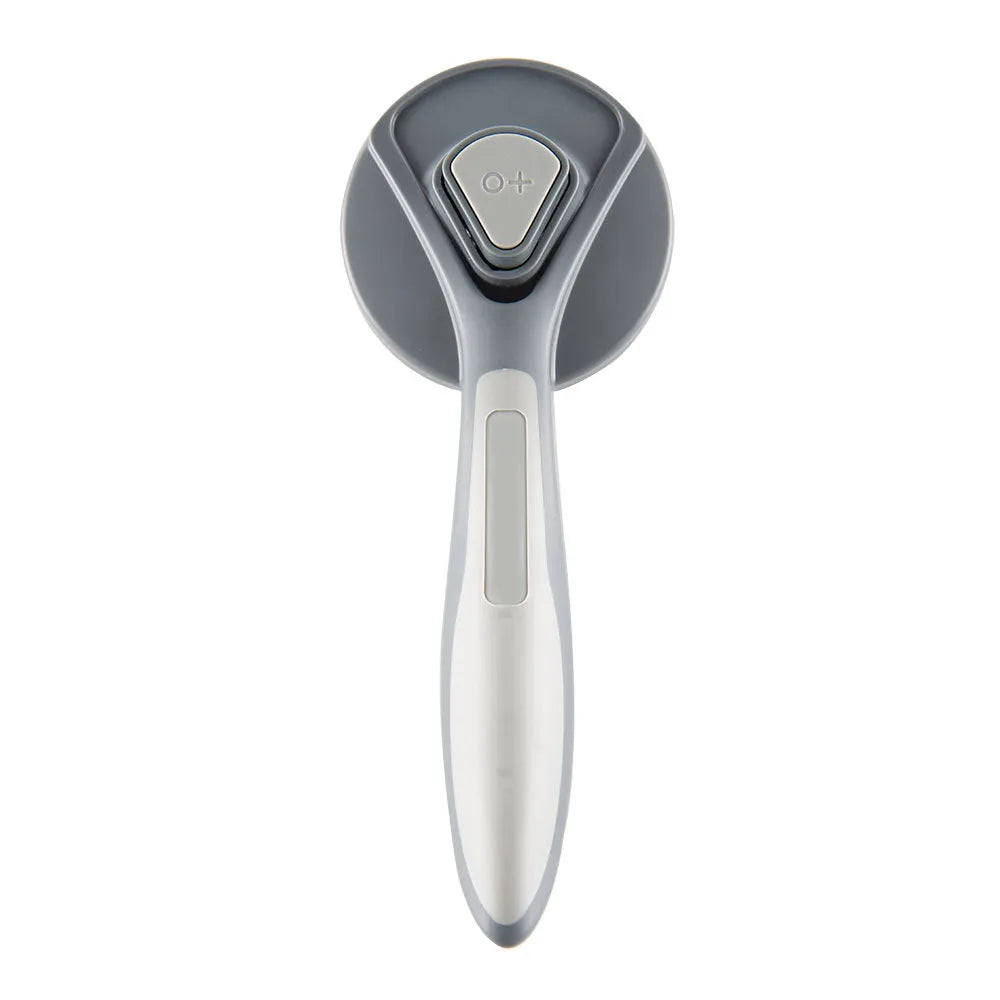 Grey self-cleaning slicker brush for grooming cats and dogs, showing the one-touch button and soft bristles.