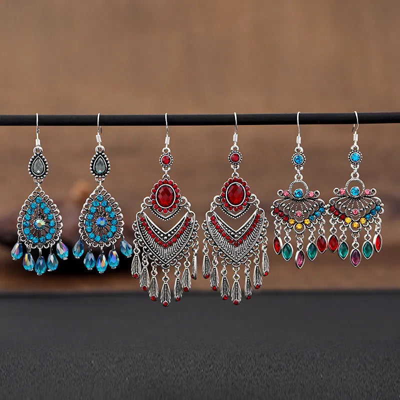 Purple retro drop earrings with long crystal fringe detailing and ethnic styling elements