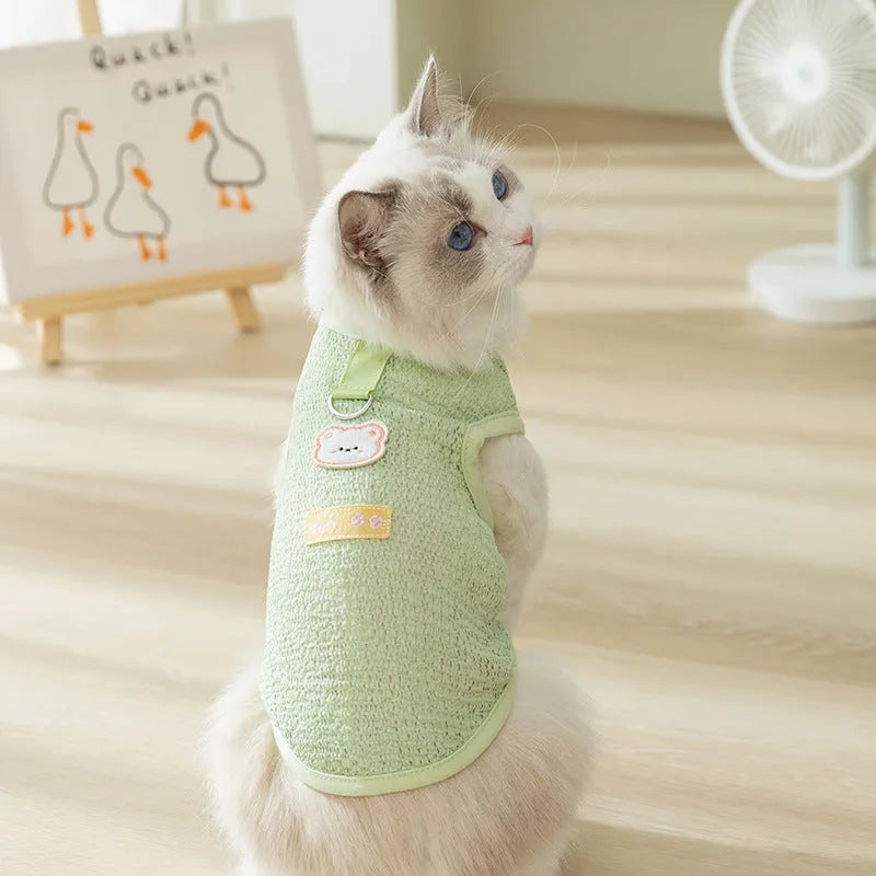 Green hollowed-out cat knitwear with a bear patch, shown in size M on a mannequin.