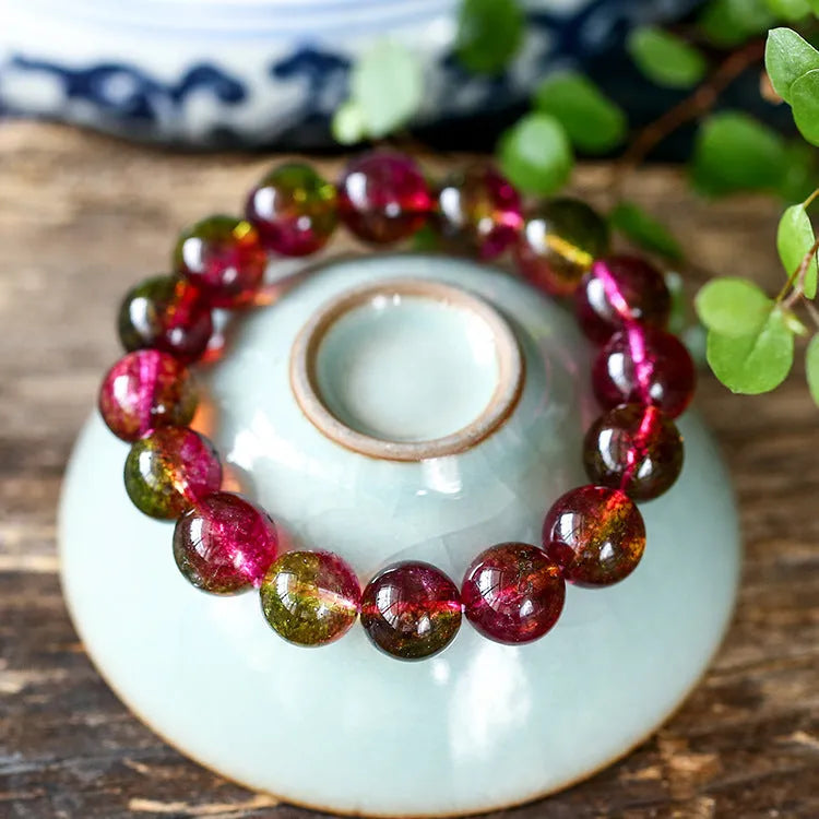 Close-up of a handmade pastel pink and green watermelon crystal bracelet for women, showing bead detail.