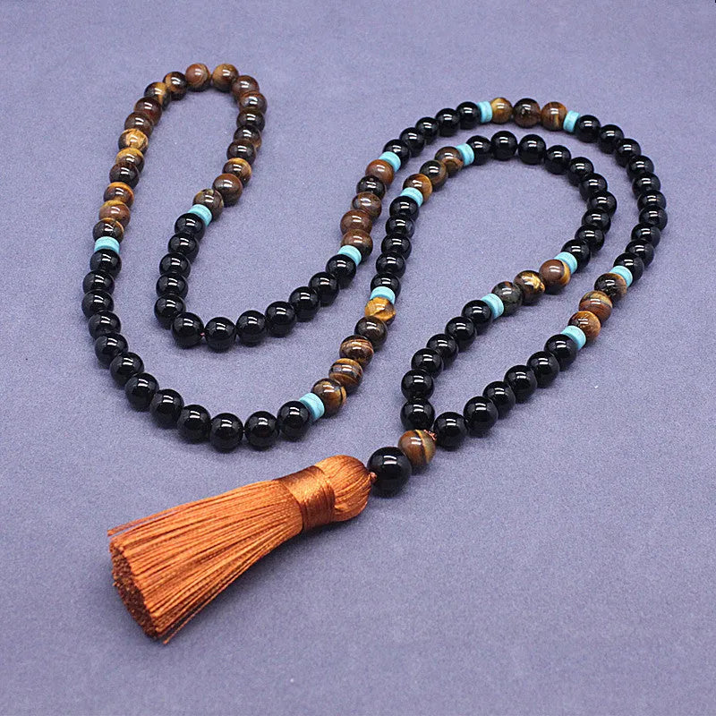 Black agate and tiger's eye geometric beaded bracelet and necklace set.