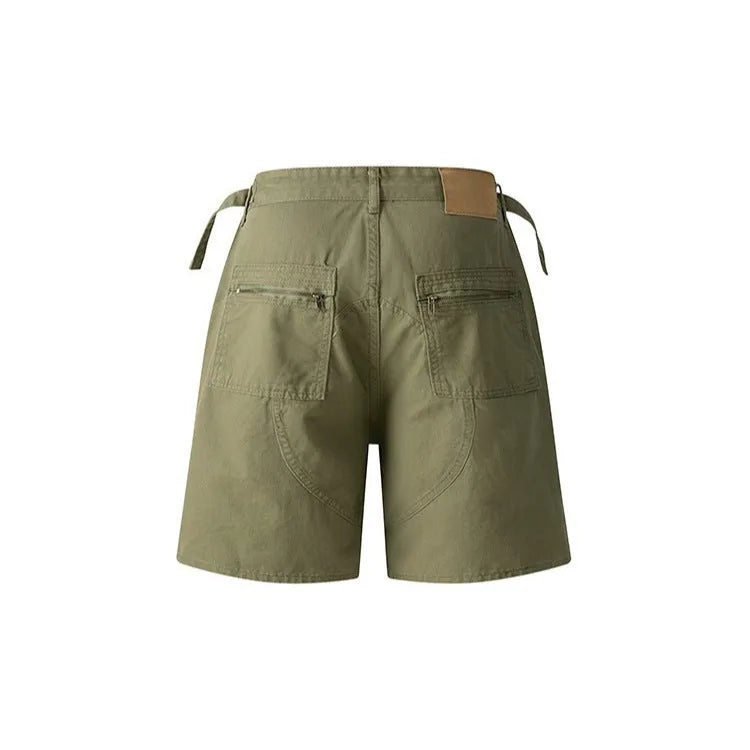 Retro loose-fit washed cotton shorts in camouflage with a zipper pocket.