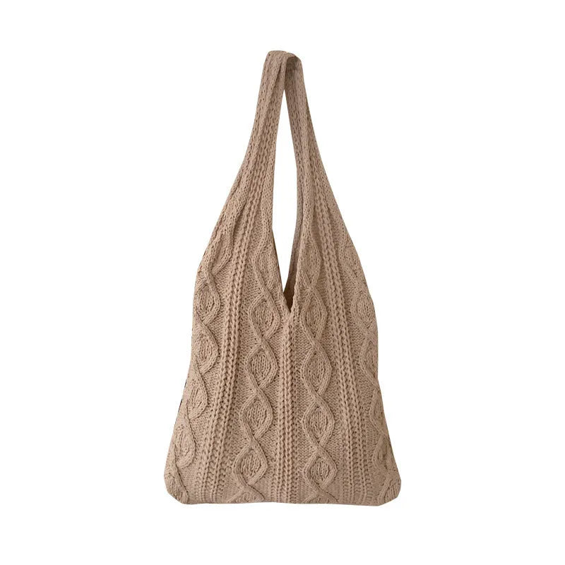 GWomen retro crochet shoulder tote bag in a solid colour, showing knitted texture and double strap connectors.