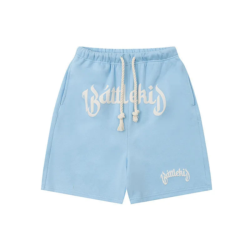 Loose grey cotton-blend street shorts with elasticated waist on a mannequin.
