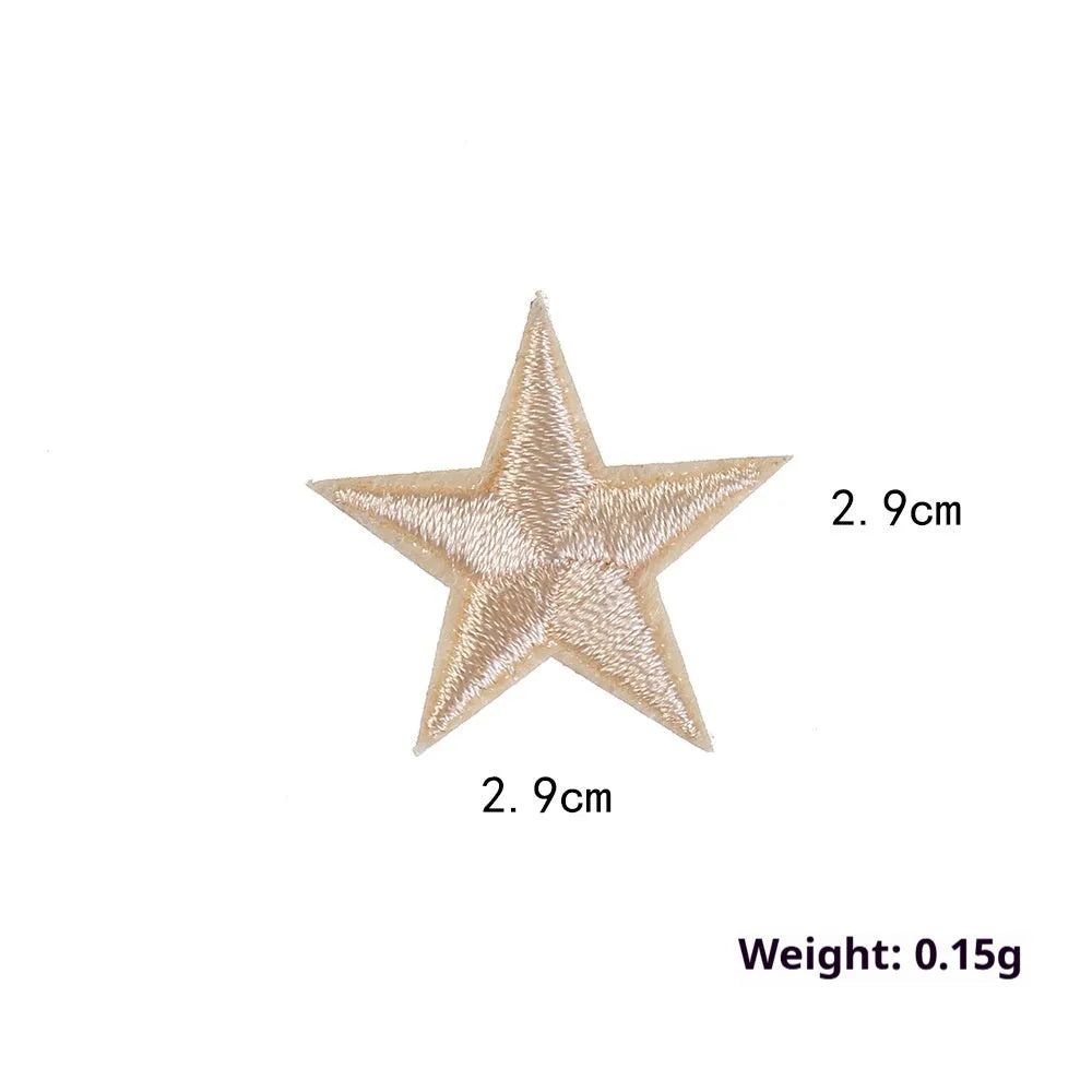 Colourful five-pointed star cloth embroidery stickers for DIY clothing decoration on a fabric background.