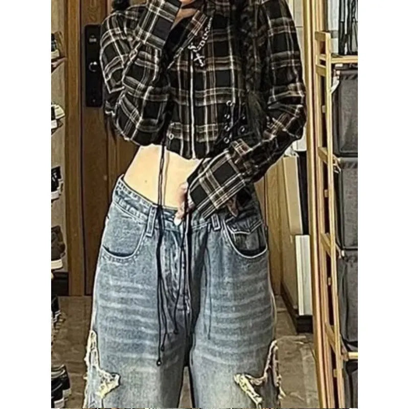 Blue women's high waist wide-leg denim jeans on a hanger, showing the straight leg cut.