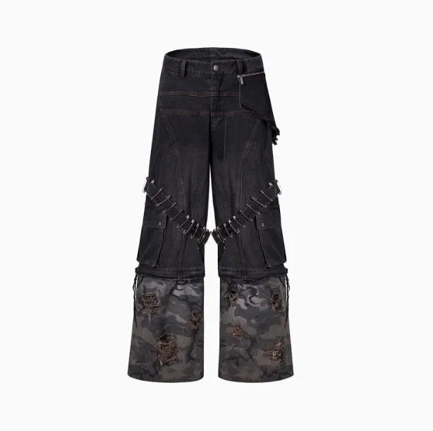 Men's grey jeans with camouflage splicing design and pin and ribbon details on the legs.
