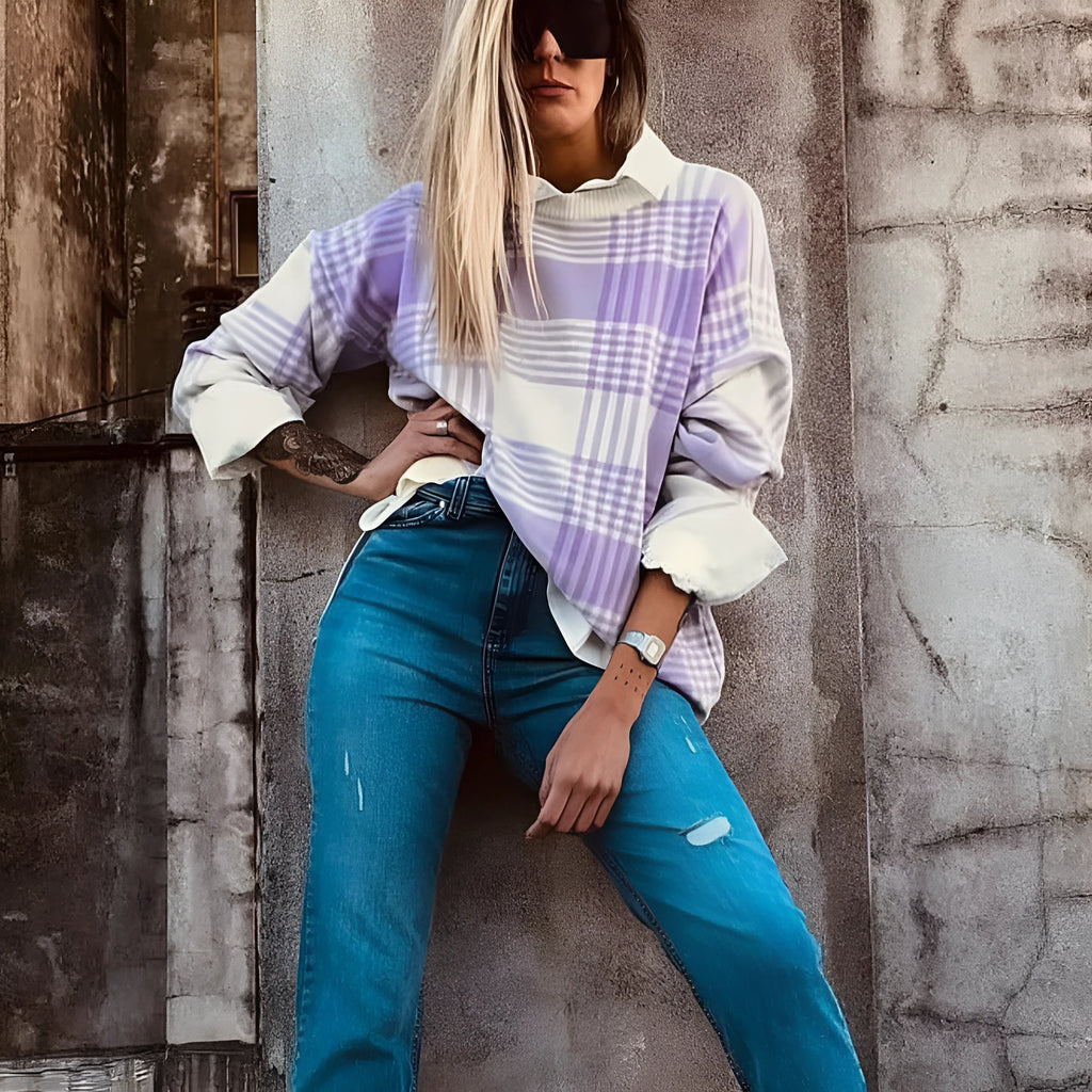 Lilac plaid print loose long-sleeve sweater with ribbed trim on mannequin.