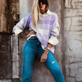Lilac plaid print loose long-sleeve sweater with ribbed trim on mannequin.