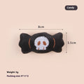 Small cat teaser wand toy with plush candy and skull attachments on string