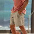 Men's army green cotton blend drawstring shorts with a floral heat transfer patch on the leg.