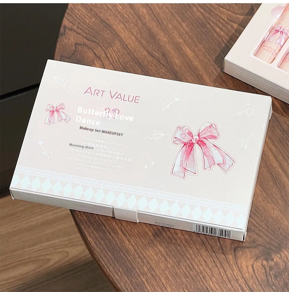 Butterfly Box Suite makeup set showing four matte lip muds, powder blusher, and coordinating necklace