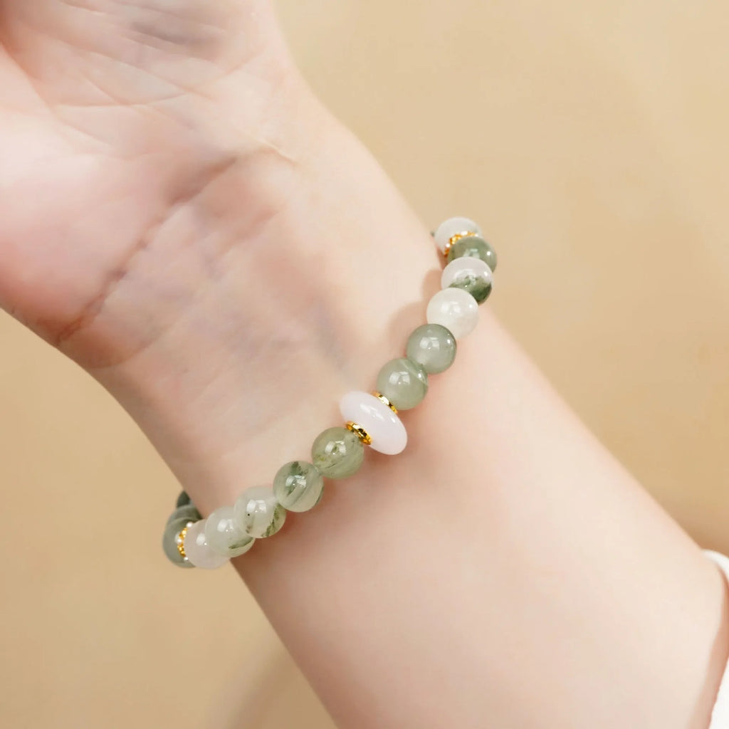 Emerald green Tian Shan Cui women's bracelet with floating flower girl design and round elements
