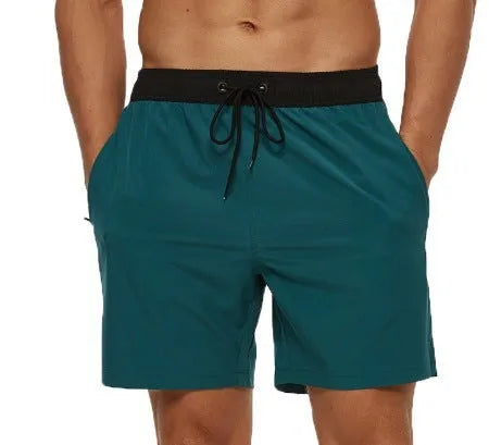 Men's blue fitness shorts with a drawstring waistband and a side zipper pocket.