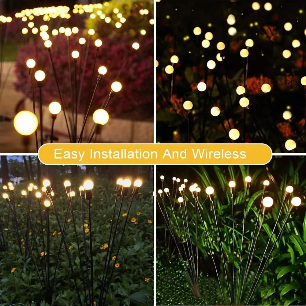 Solar-powered LED firefly garden spike light with multiple heads and a press-in ground plug on grass.