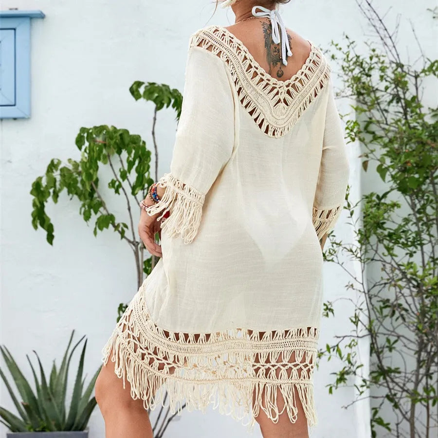 Women's apricot coloured crocheted patchwork dress with half sleeves on a model.