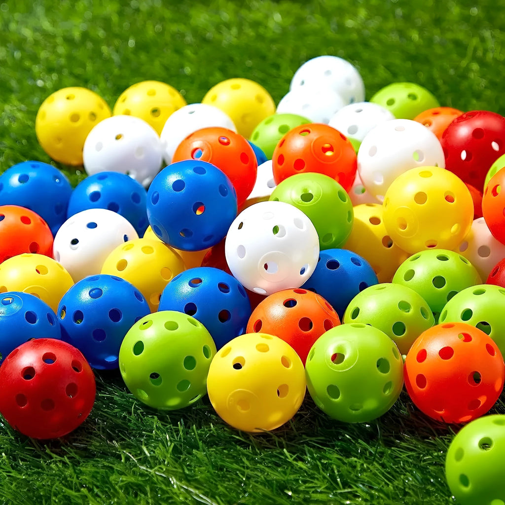 Multi-coloured 42mm golf practice balls with dimpled design in a net bag.