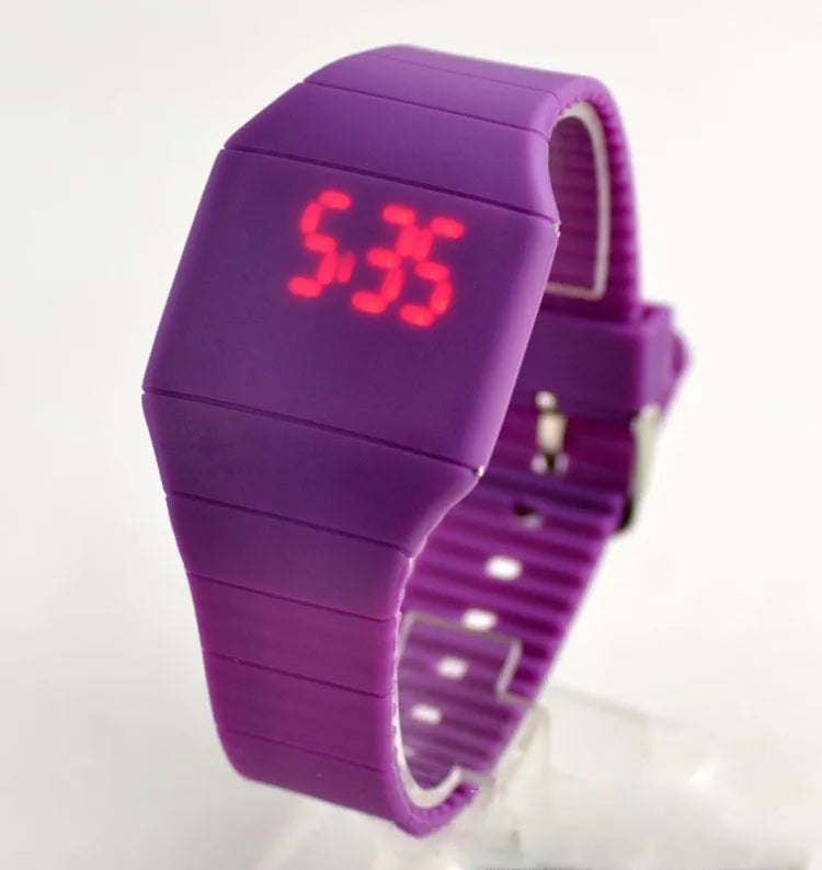 Square electronic touch screen watch with digital display on a PU strap, shown in multiple colour options.