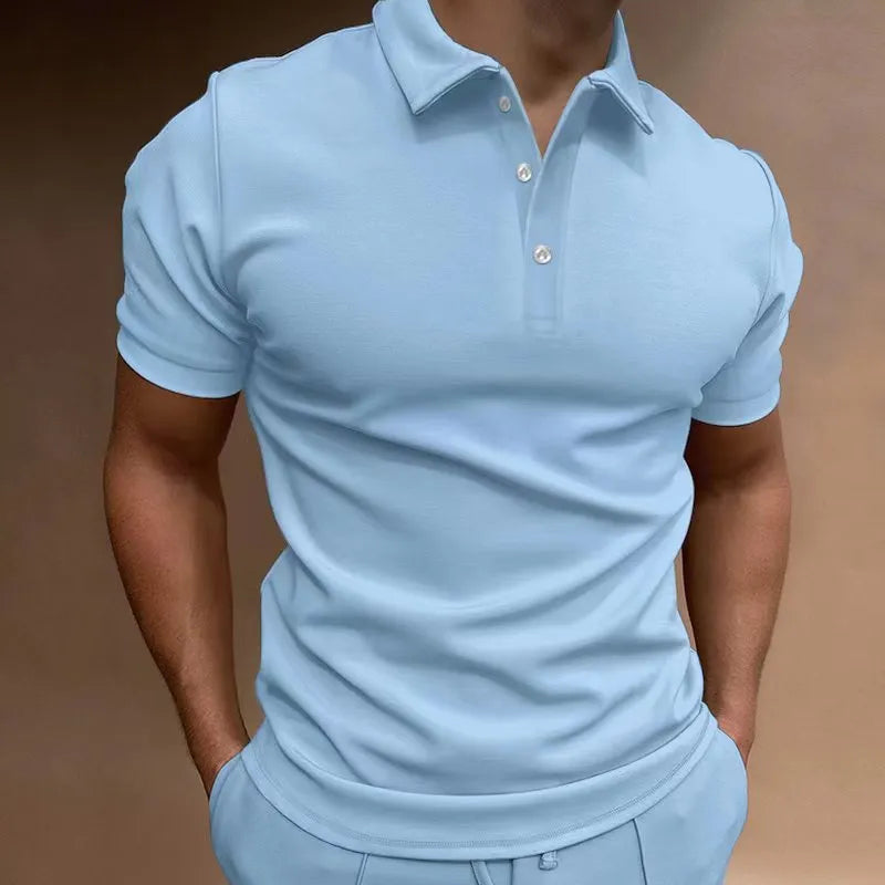 Man modelling a loose fit grey cotton blend short sleeve t-shirt.