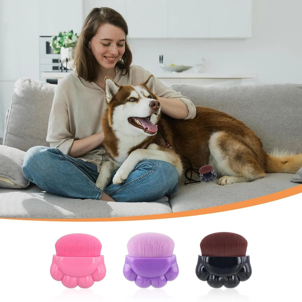 Three pet paw-shaped balm brushes with soft fibre heads in storage boxes