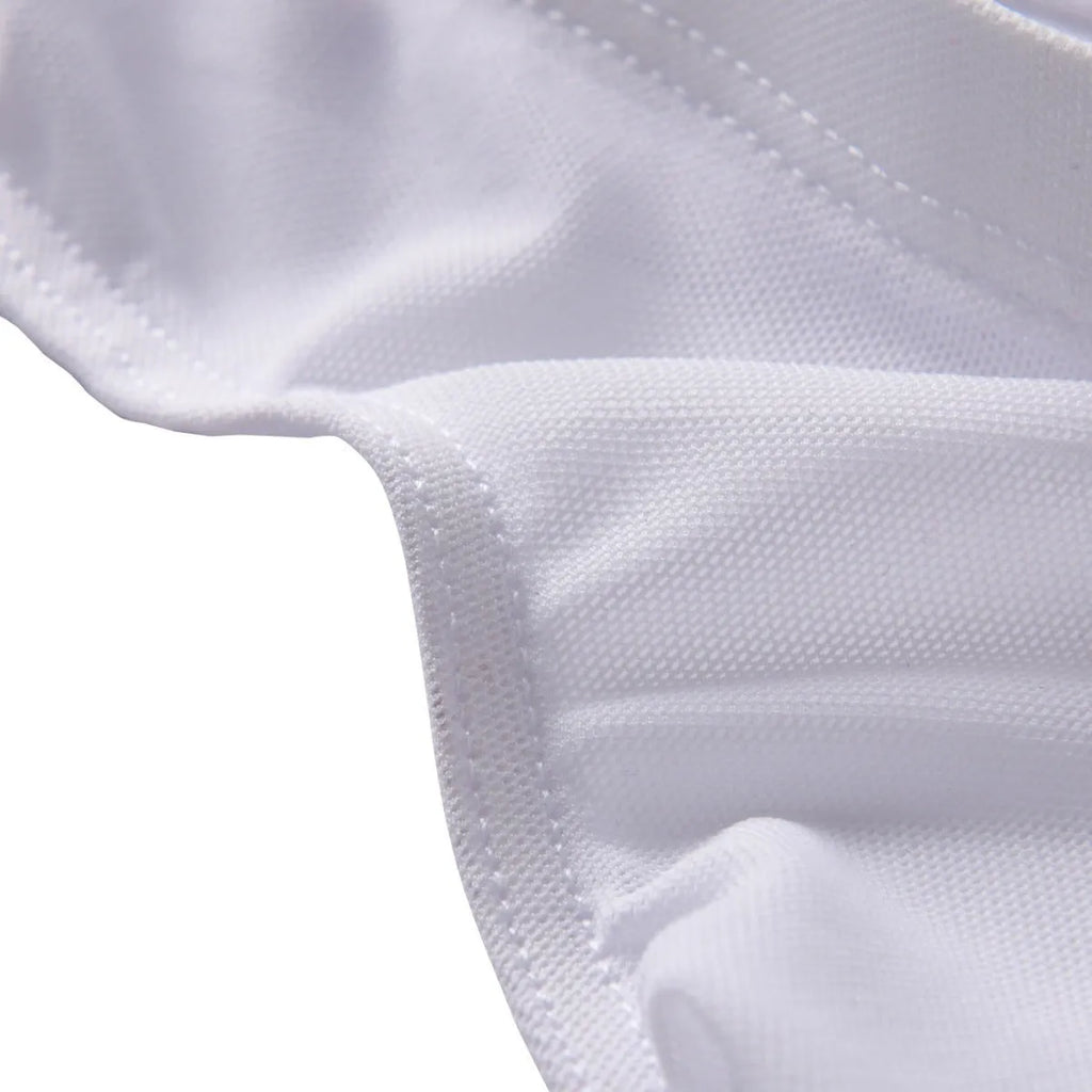 Men's black low-waist nylon briefs laid flat, showing triangle front design and knit fabric texture.