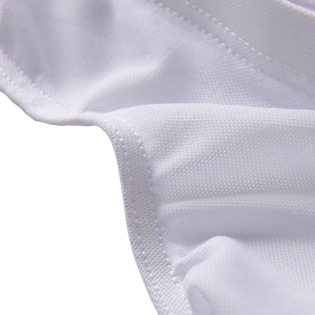 Men's black low-waist nylon briefs laid flat, showing triangle front design and knit fabric texture.