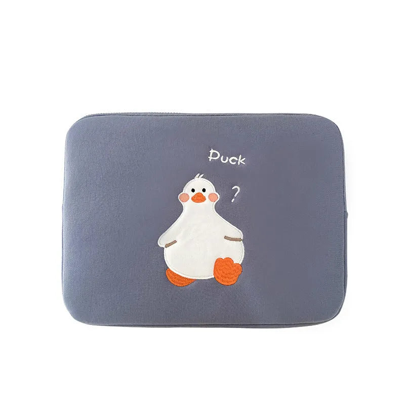 Blue cotton tablet case with embroidered cartoon duck design and a black zipper, shown open.