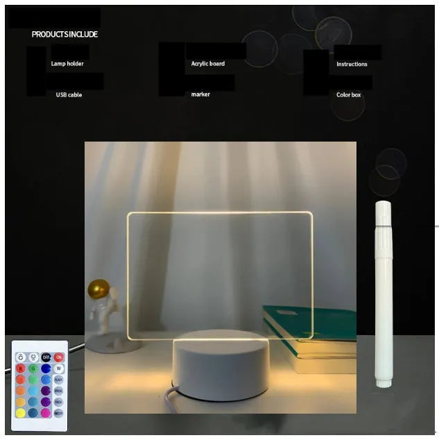 Black 3D acrylic message board night light with remote control and stylus on desk.