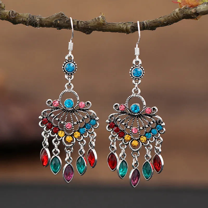 Purple retro drop earrings with long crystal fringe detailing and ethnic styling elements
