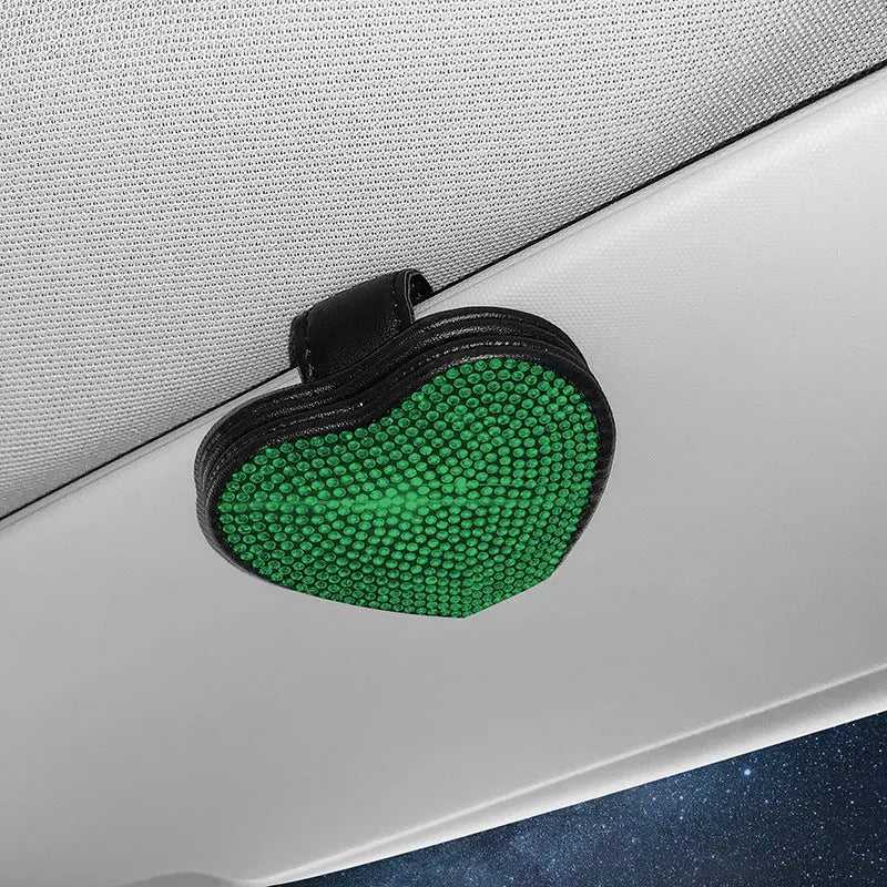 Black PU leather magnetic storage clip with diamond encrustment, shown attached to a car sun visor.
