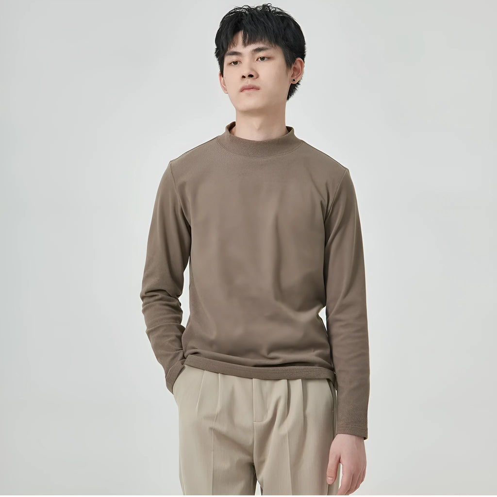 Man wearing a brown Dralon half-high collar long sleeve t-shirt for casual autumn wear.