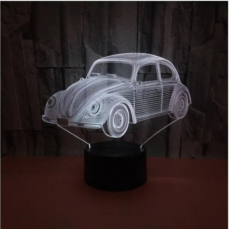 Black 3D acrylic LED table lamp with touch and remote control on wooden desk