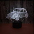 Black 3D acrylic LED table lamp with touch and remote control on wooden desk