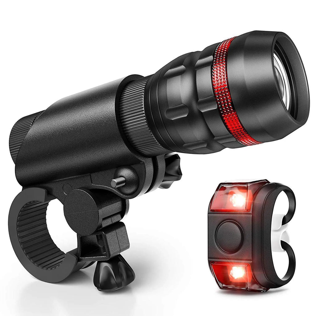 Bicycle front headlight and red rear taillight set with a black mounting bracket.