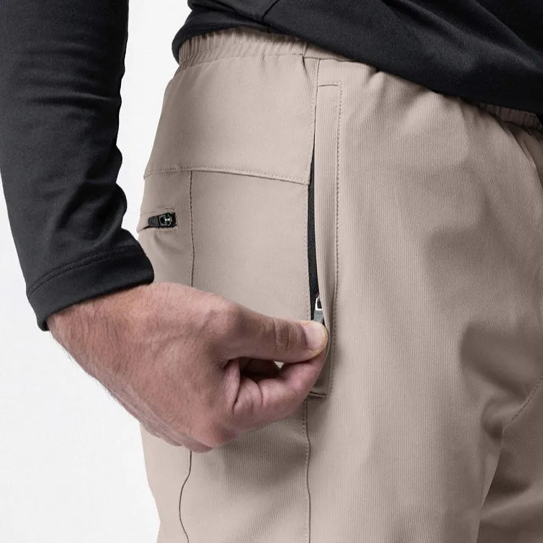 Men's grey ankle-tied loose fitness running trousers on a hanger.