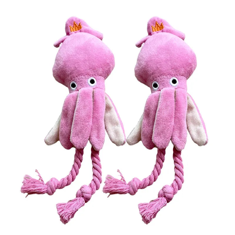 Pink squid-shaped corduroy dog chew toy with a squeaker.