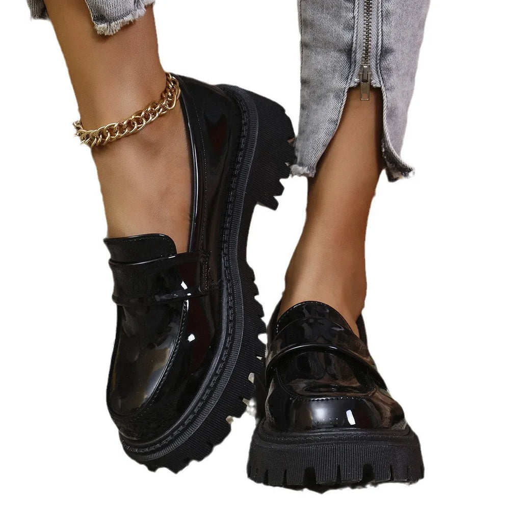 British-style slip-on loafers with a chunky mid heel and thick rubber platform sole.