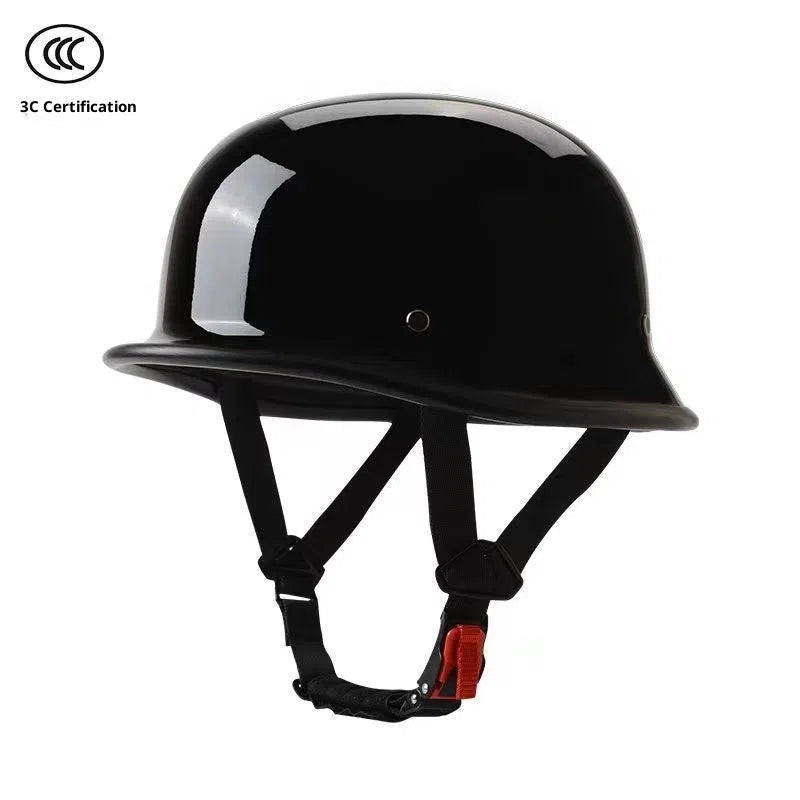 Men's retro motorcycle helmet in matte black ABS construction, side view on white background