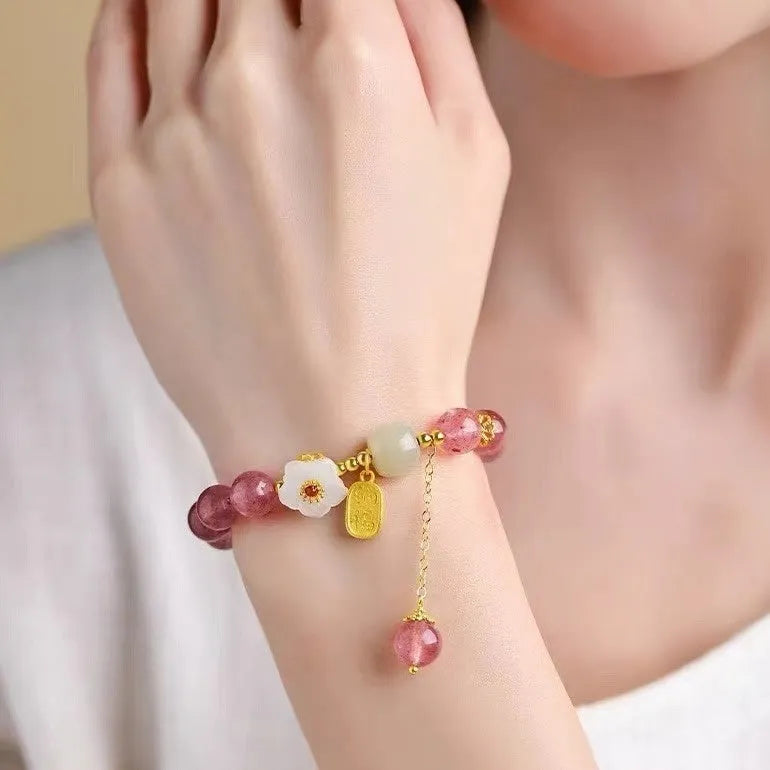 Handmade women's bracelet with Hetian jade and strawberry quartz crystals in peach blossom design